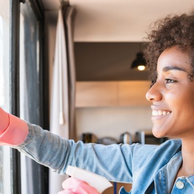 Woman Cleaning Windows | Rubio Air Conditioning Inc. of Naples, Florida